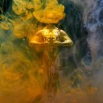 gold coloured human statue